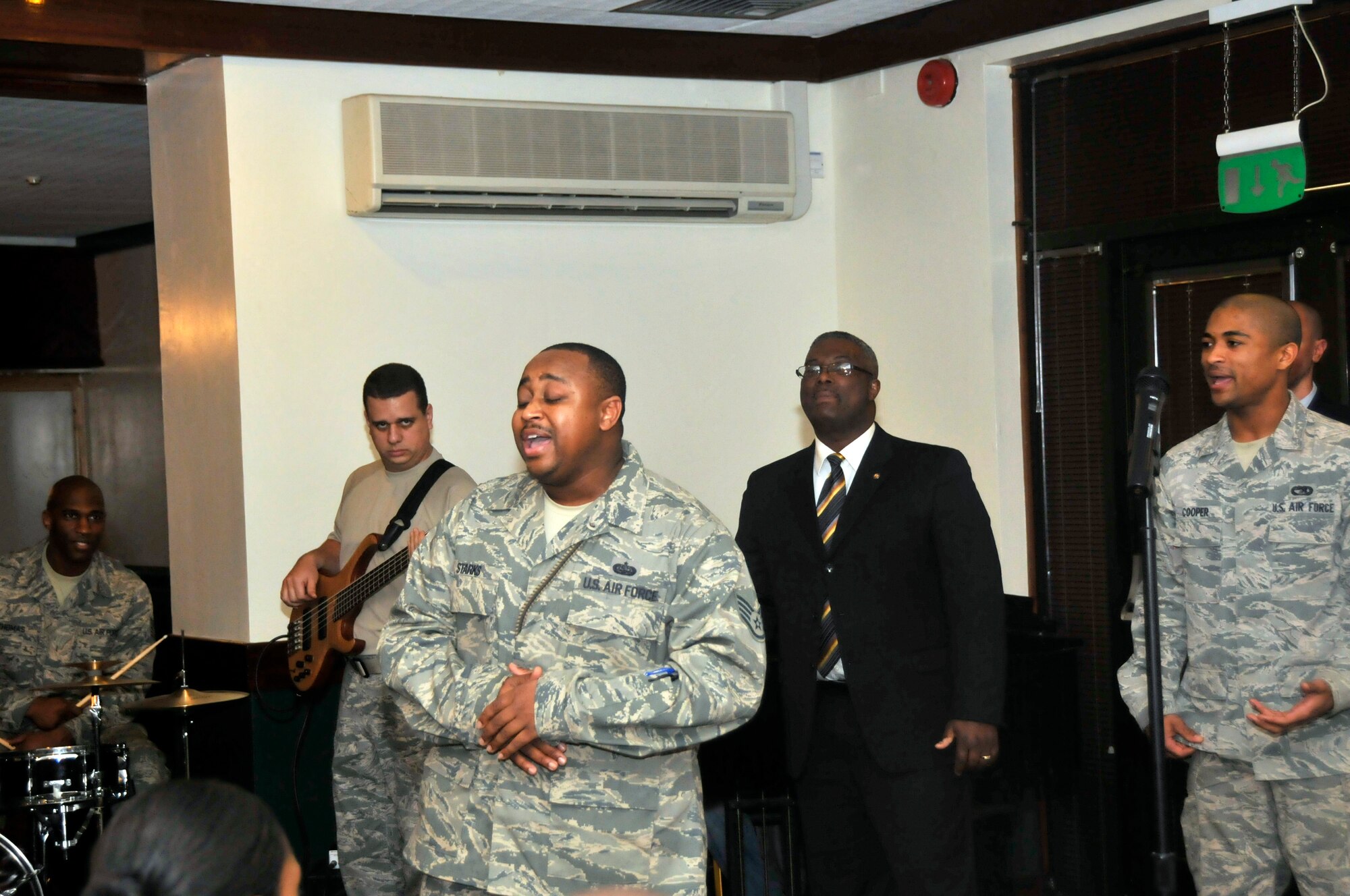 ROYAL AIR FORCE LAKENHEATH, England -- Staff Sgt. Leo Starks, 48th Communications Squadron client support technician, leads the RAF Lakenheath Chapel Mens Choir in a song during the Martin Luther King Luncheon at Eagles Landing on Jan. 13. (U.S. Air Force photo/Airman 1st Class Eboni Reams)