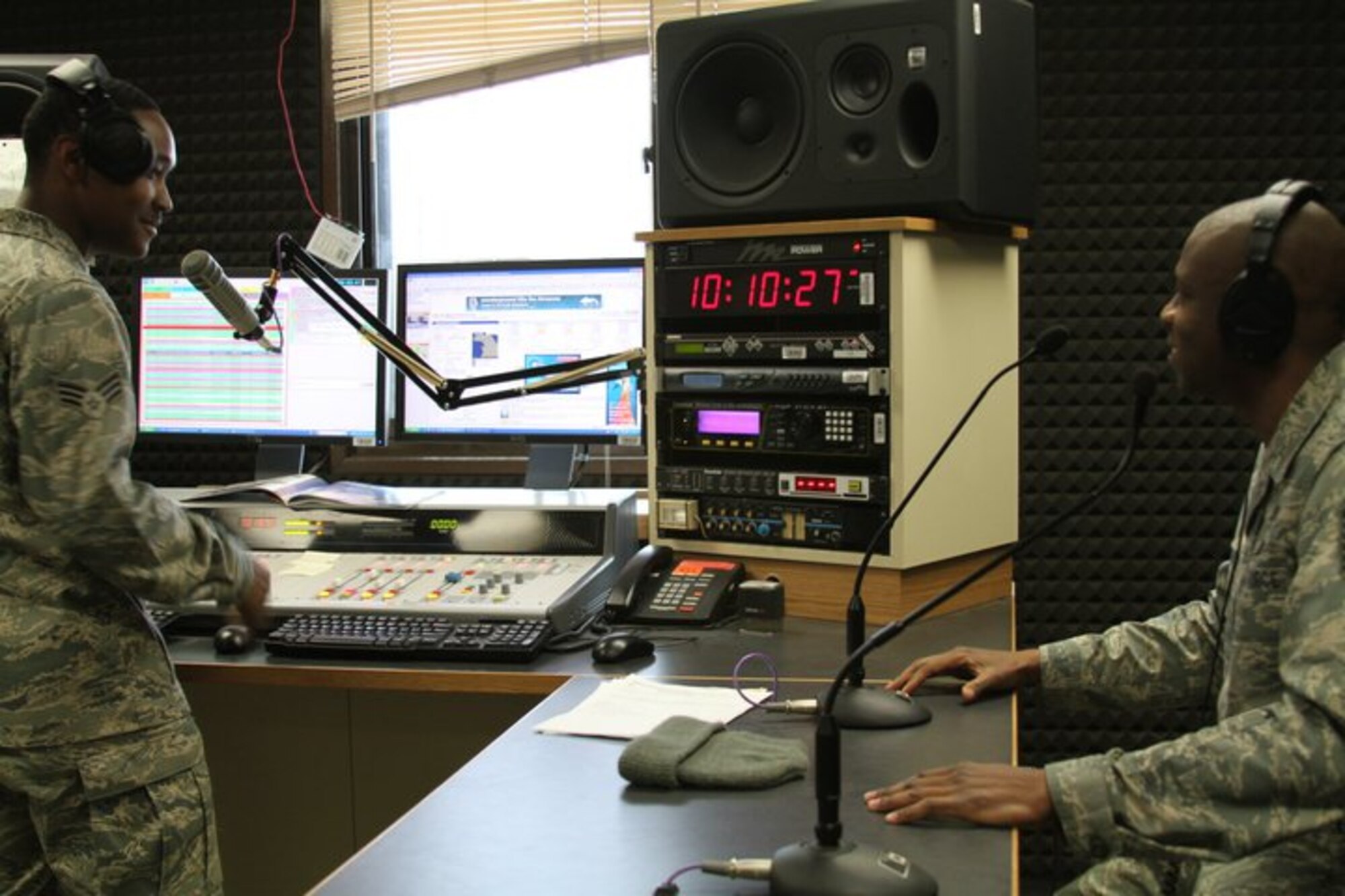 Master Sgt. Kevin Hardman, 51st Fighter Wing Safety, spins a few tunes as the first "Lunch Box DJ" with Senior Airman Mike Watts, Armed Forces Network Osan disc jockey, Jan. 7. AFN introduced the new program last week to give supervisors a chance to recognize their Airmen by having them co-host their afternoon radio show. Supervisors can email lunchboxdj@afn.dma.mil and AFN will announce the week's lunchbox DJ on Wednesday at 11 a.m. The selected Airman will be on that Friday's afternoon Weekday Rewind program as a guest DJ from 11 a.m to 1 p.m. playing 1980's and 90's music for the Osan and U.S. Army Garrison Humphreys communities. (Courtesy photo)
