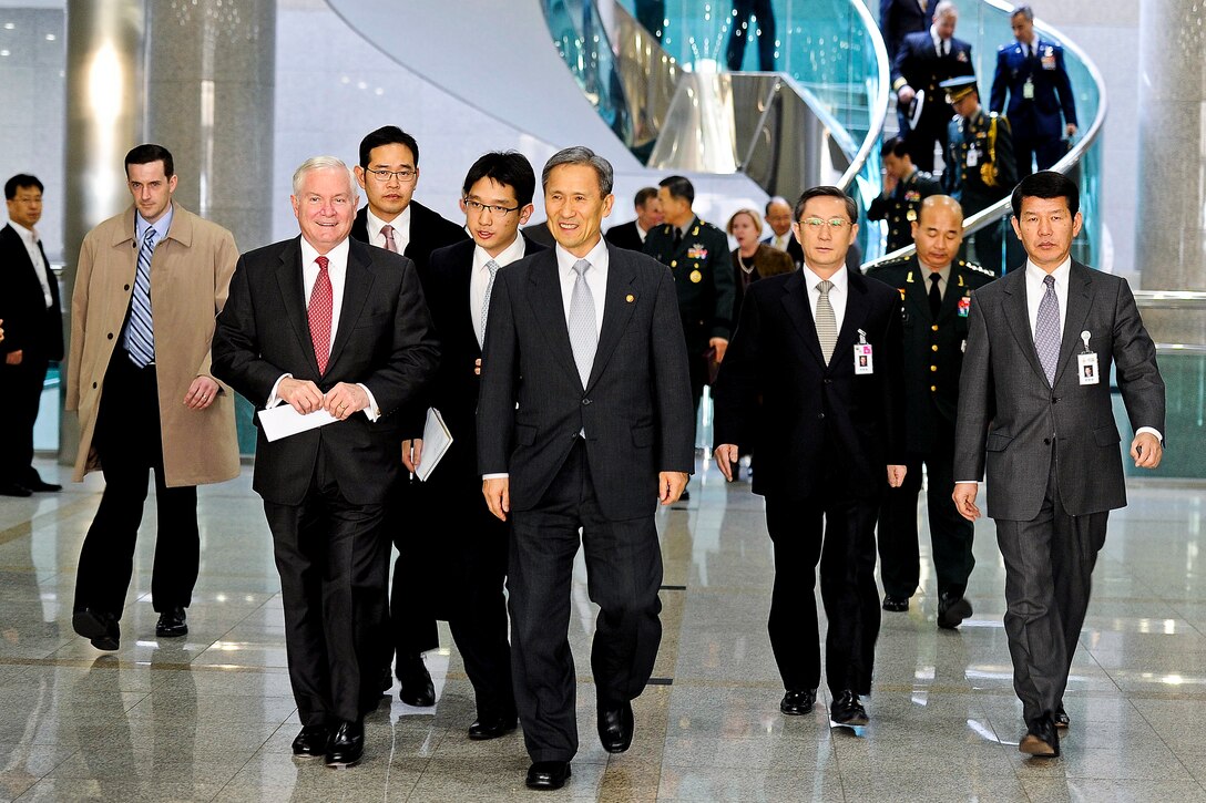 U.S. Defense Secretary Robert M. Gates walks with South Korean Defense Minister Kim Kwan-jin at the Ministry of Defense in Seoul, South Korea, Jan. 14, 2011.