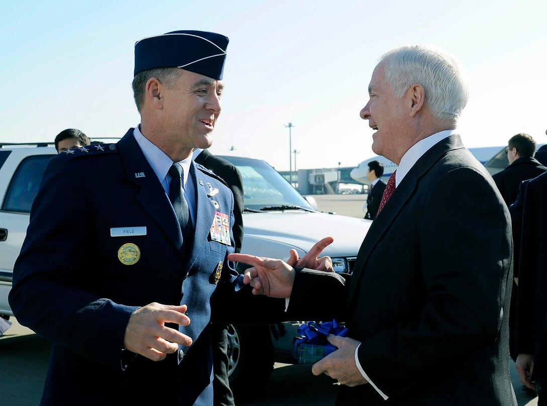 U.S. Air Force Lt. Gen. Burton Field, commander of U.S. Forces Japan, bids farewell to U.S. Defense Secretary Robert M. Gates after a two-day visit to Tokyo, Jan. 14, 2011.