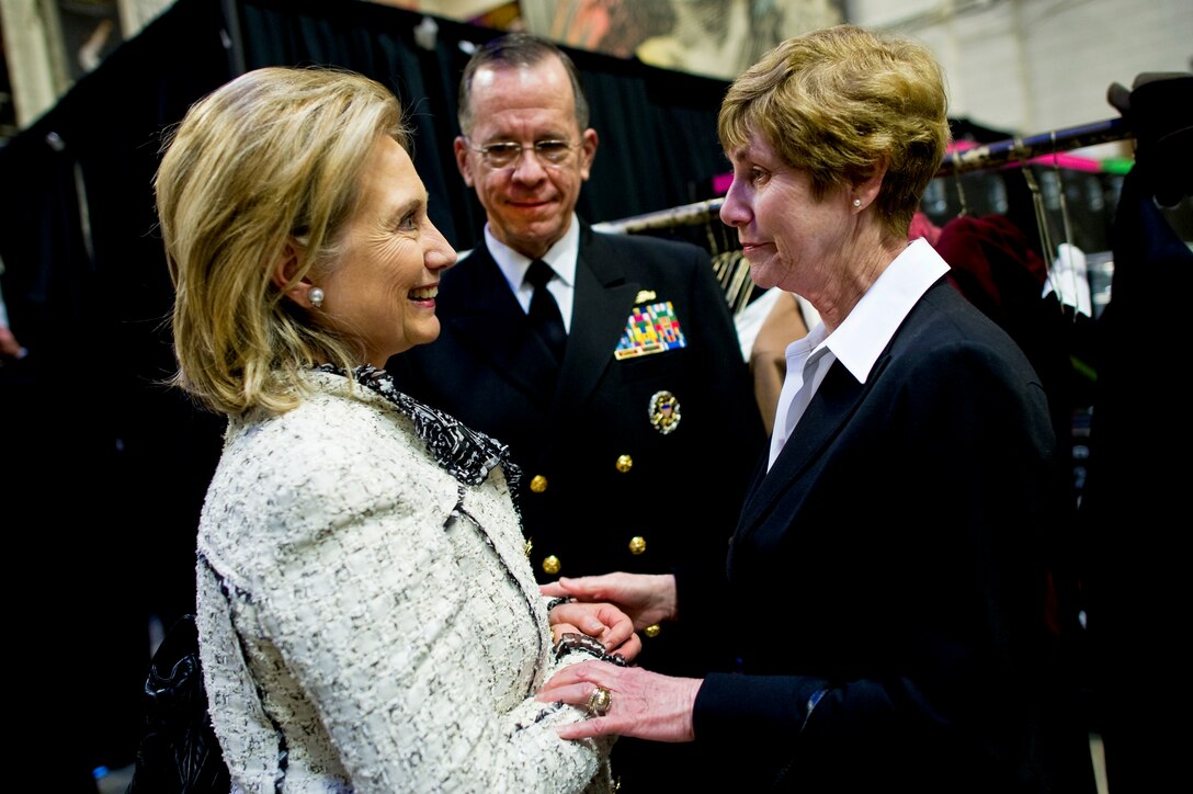 Secretary of State Hillary Clinton, Navy Adm. Mike Mullen, chairman of the Joint Chiefs of Staff, and his wife, Deborah, speak backstage at the memorial service for Ambassador Richard C. Holbrooke at the John F. Kennedy Center for Performing Arts in Washington, D.C., Jan. 14, 2011.