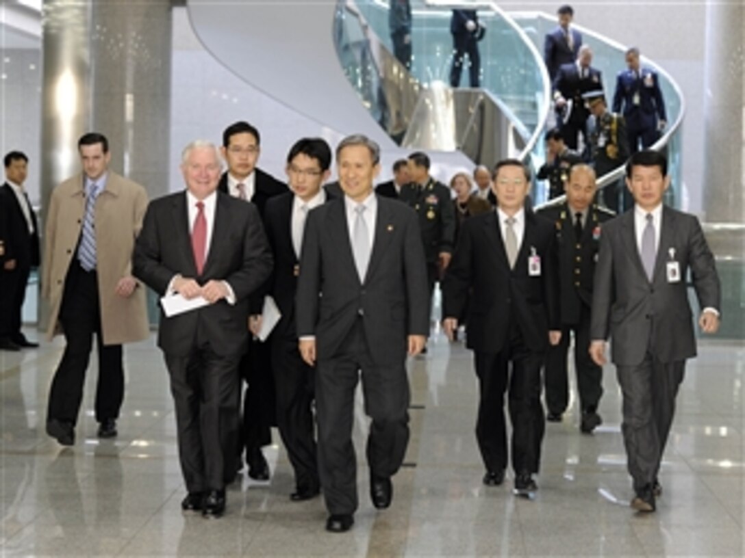 Secretary of Defense Robert M. Gates walks with Korean National Defense Minister Kim Kwan-jin at the Ministry of Defense in Seoul, Republic of Korea, on Jan. 14, 2011.  Gates is meeting with President Lee Myung-bak and Defense Minister Kim Kwan-jin to discuss U.S and Korean defense issues.  