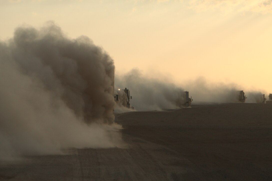 A cloud of ‘moon dust’ forms as a combat logistics patrol from Motor Transport Company B, Combat Logistics Battalion 3, 1st Marine Logistics Group (Forward), returns to Camp Dwyer after delivering supplies to Forward Operating Base Geronimo in Afghanistan’s Helmand province, Jan. 14.