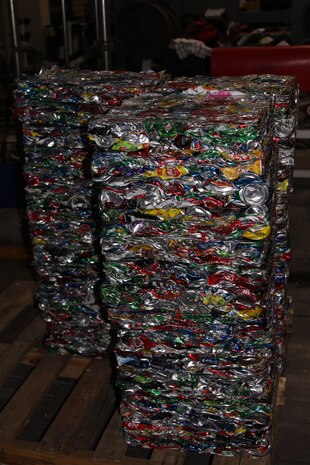 Blocks of crushed, recycled aluminum cans sit at the recycling center during an initial hazardous waste handlers class here Jan. 13-14. The class covered Marine Corps Air Station Iwakuni Order 5090.8, the Hazardous Waste and Non-regulated Waste Management Plan.