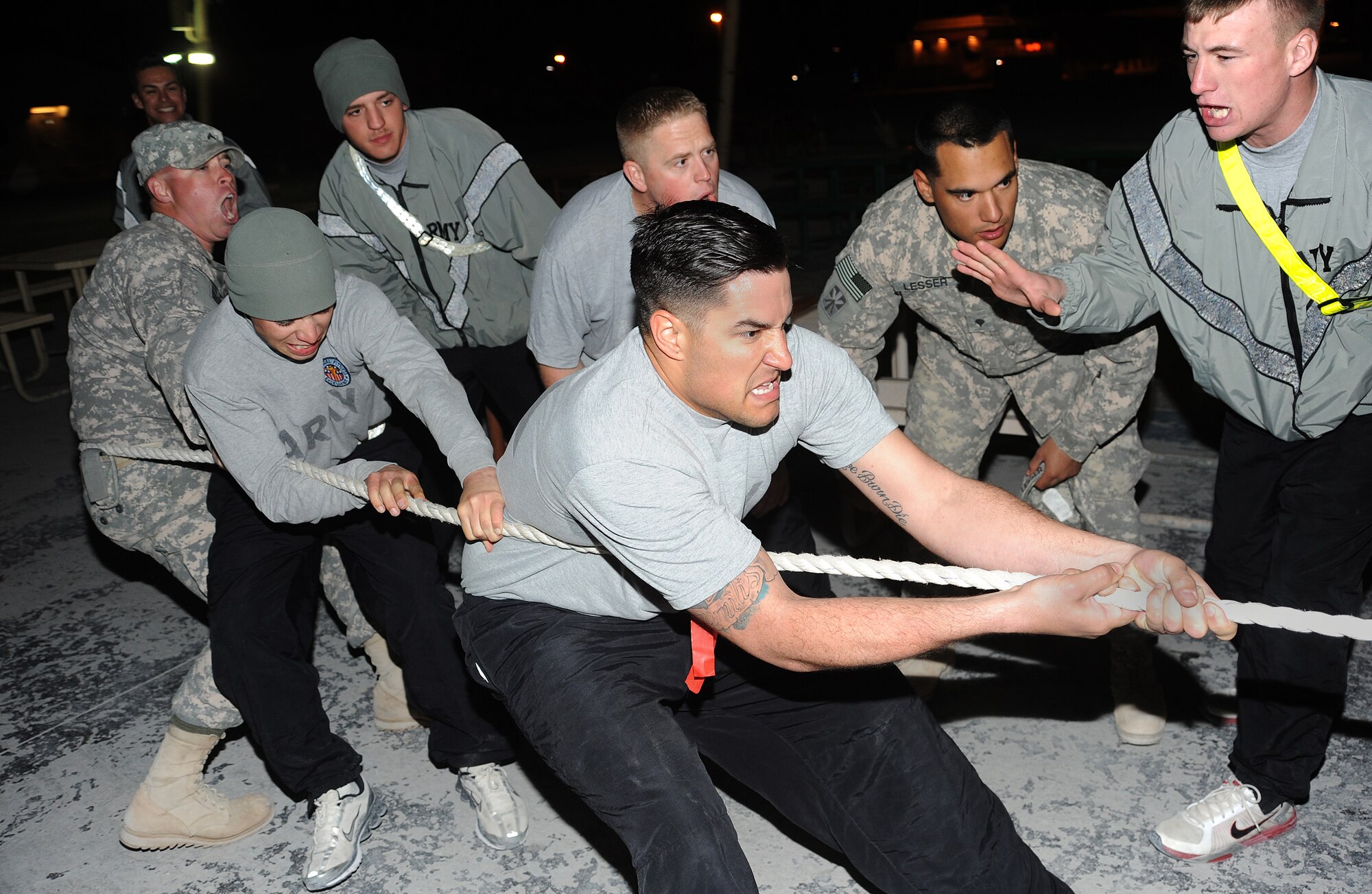 Specialist's Johnny Hottinger, Nicholas Steinmeyer and Adam Sousie take the tug of war challenge at the Memorial Plaza, Jan. 13.  (U.S. Air Force photo/Staff Sergeant Liliana Moreno)                     