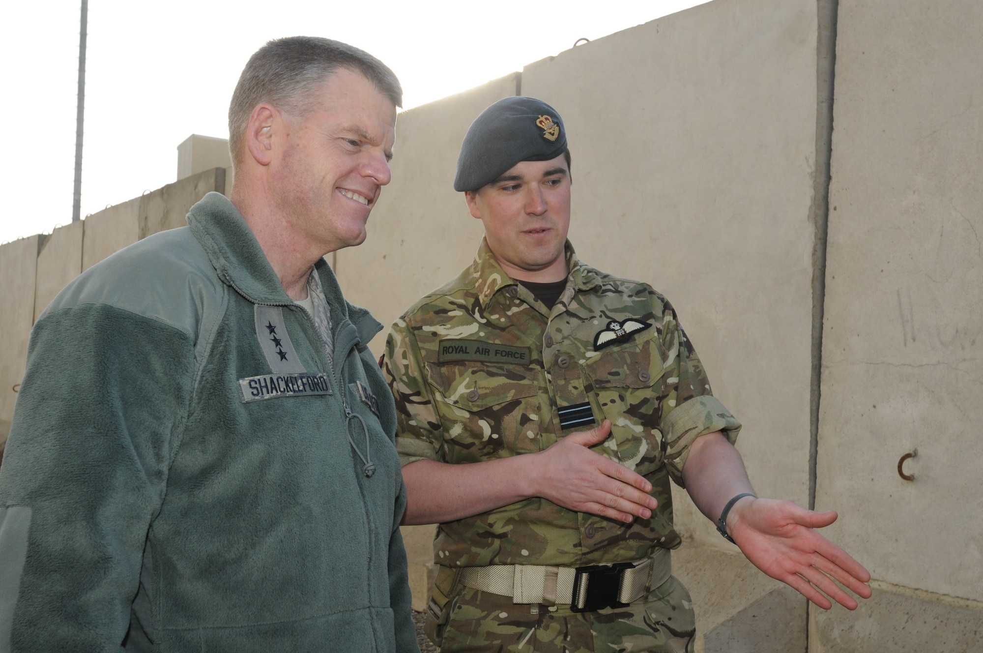 KABUL, Afghanistan - Royal Air Force Officer John Parry explains to  Lt. Gen. Mark Shackelford the leadership exercises the Afghan Lieutenants are taking part in during Gen. Shackelford's  tour of the Afghan Air Force English immersion lab known as the "Thunder Lab" at Kabul, Afghanistan Jan. 15. (U.S. Air Force photo by Airman 1st Class Lausanne Morgan/RELEASED).