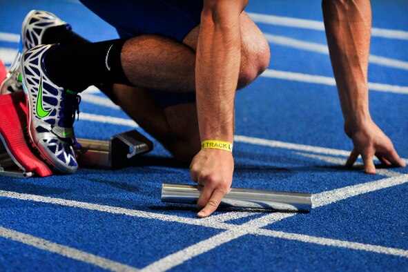 Junior Brice Bergman prepares to start the men's 4x400-meter relay during the annual Air Force All-Comers Meet at the Cadet Field House Jan. 14, 2011. The Falcons 4x400-meter relay team finished first among collegiate teams and second overall with a time of 3:15.59. (U.S. Air Force photo/Bill Evans)