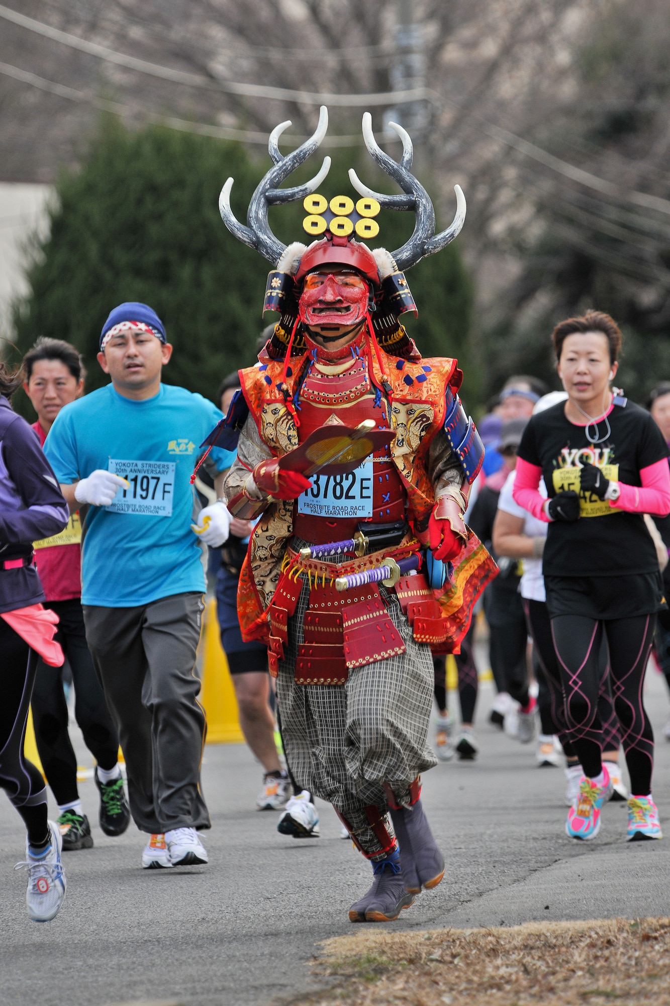 YOKOTA AIR BASE, Japan -- A runner dressed as a samurai warrior participates in the 30th Annual Frostbite Run here, Jan. 16. Some of the 6,000 runners who participated chose to wear costumes, an act that has become a yearly tradition. (U.S. Air Force photo/Osakabe Yasuo)