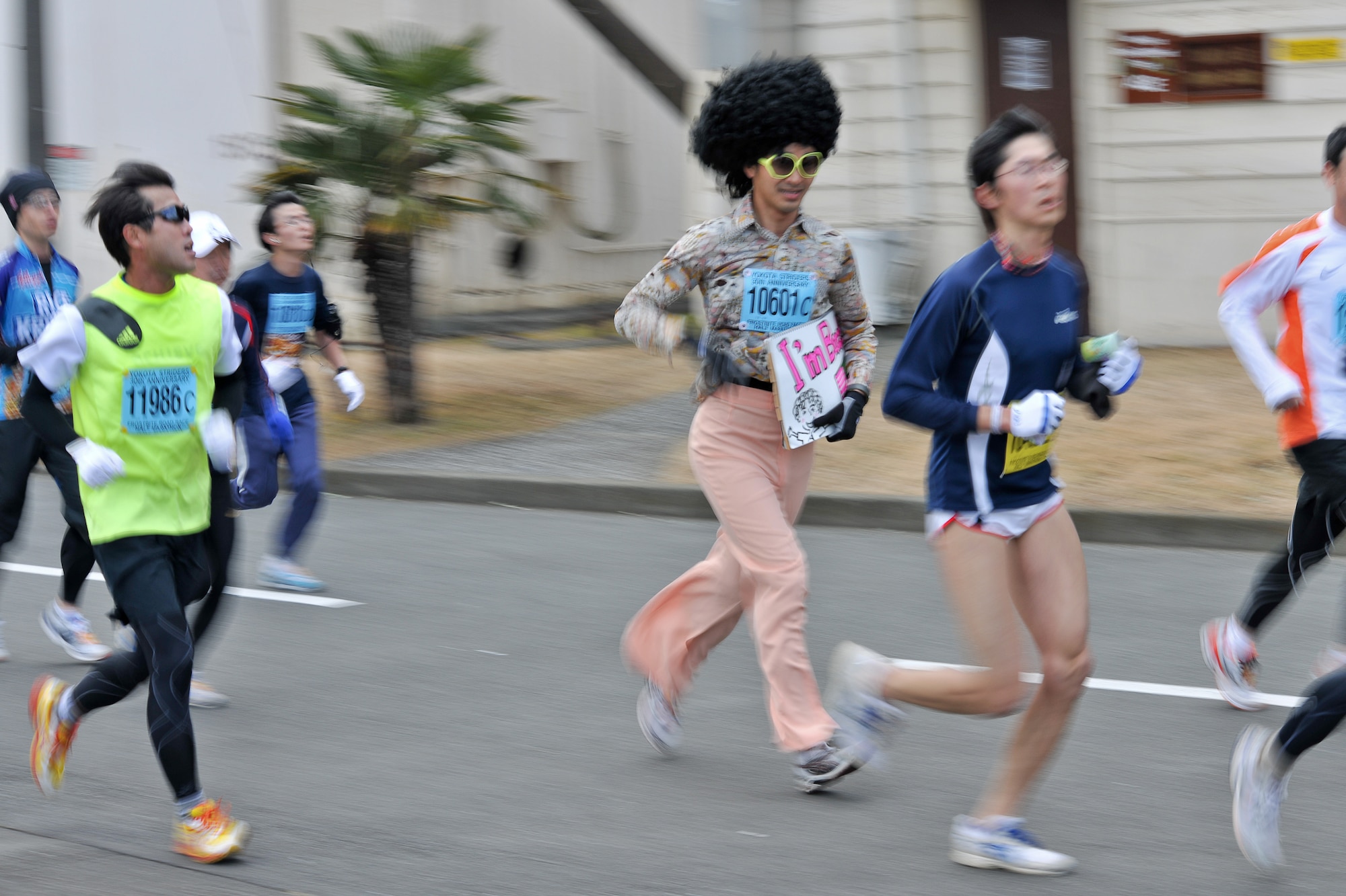 YOKOTA AIR BASE, Japan -- A runner dressed as a 1970's disco attire participates in the 30th Annual Frostbite Road Race here, Jan. 16. Some of the 6,000 runners who participated chose to wear costumes, an act that has become a yearly tradition. (U.S. Air Force photo/Osakabe Yasuo)