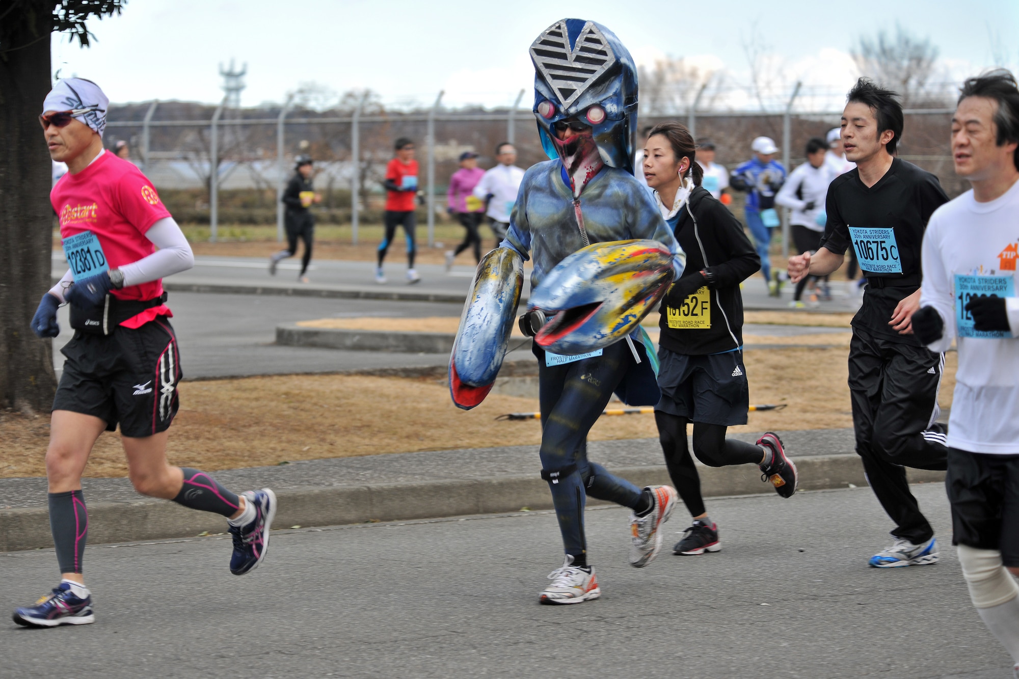 YOKOTA AIR BASE, Japan -- A runner dressed as a Japanese cartoon character participates in the 30th Annual Frostbite Road Race here, Jan. 16. Some of the 6,000 runners who participated chose to wear costumes, an act that has become a yearly tradition. (U.S. Air Force photo/Osakabe Yasuo)