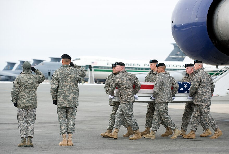 A U.S. Army carry team transfers the remains of Army Sgt. Michael P. Bartley of Barnhill, Ill., at Dover Air Force Base, Del., Jan. 17, 2011.  (U.S. Air Force photo/Jason Minto)