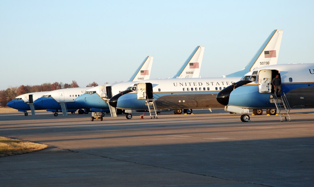 A maintainer from the 932nd Airlift Wing walks down the stairs of a C-9C on a cold, brisk day after checking the aircraft for its next flight. The three planes at far left are the newer C-40C, also owned by the Air Force Reserve Command unit located at Scott Air Force Base, Ill.  (U.S. Air Force photo/Maj. Stan Paregien)