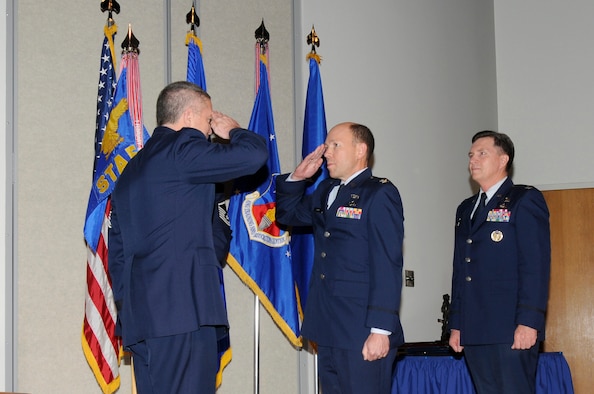 McGHEE TYSON AIR NATIONAL GUARD BASE, Tenn. - Col. Bradley N. McRee, center, accepts command of The I.G. Brown Air National Guard Training and Education Center from Maj. Gen. William H. Etter, left, the deputy director of the Air National Guard, in a ceremony held at Spruance Hall here, Jan. 14, 2011, while former commander, Col. Richard B. Howard, right, looks on.  (U.S. Air Force photo by Master Sgt. Kurt Skoglund/Released) 