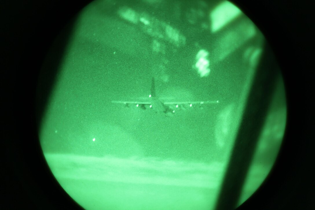 A KC-130J from Marine Aerial Refueler Transport Squadron 352, Detachment A, 3rd Marine Aircraft Wing (Forward), flies to the drop zone for a section aerial delivery to Marines of 2nd Battalion, 1st Marine Regiment, in Helmand province, Afghanistan. A section aerial delivery is comprised of two aircraft making a supply drop.  Bundles used during the drop are created using thick cardboard pallets and boxes of water, food or ammunition.  Parachutes are then attached to the top of the bundles and rigged for automatic deployment as they leave the aircraft during flight. It took the Marines about two hours, from preparing the aircraft to releasing the bundles, to successfully complete the mission. Through teamwork, the VMGR-352, Det. A, Marines continually support coalition forces on the front lines and in isolated locations by delivering the supplies they need in the quickest manner possible.
