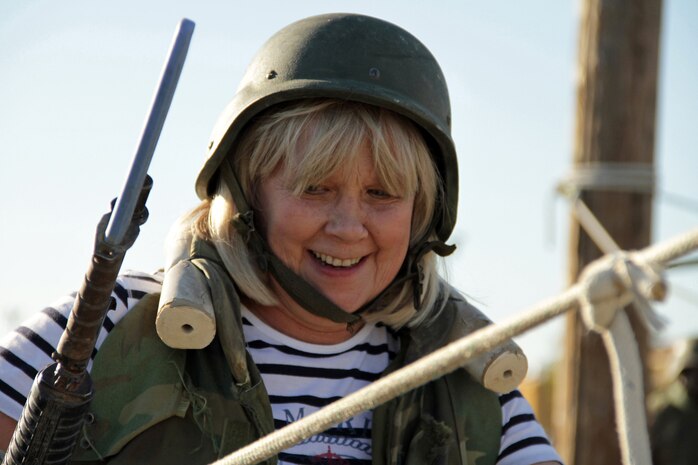 Gayle Solsvig, 58, from Stillwater, Minn., makes her way across one of the depot’s rope bridge obstacles  Jan. 18 during the 2011 Recruiting Station Twin Cities Educators' Workshop. Solsvig is the Stillwater High School College and Career Specialist. Thirty-seven educators from Minnesota and North Dakota attended the workshop. For more photos of the event, visit the RS Twin Cities fan page at www.facebook.com/rstwincities.