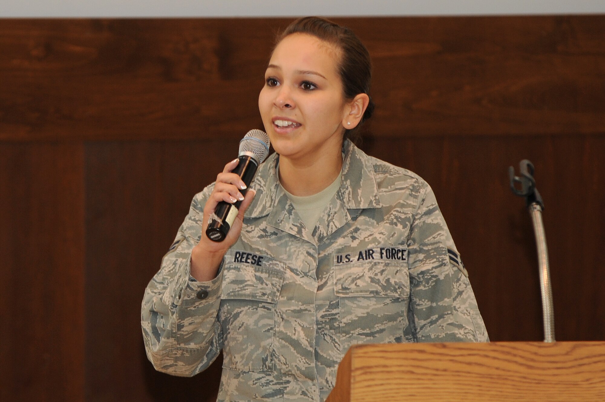 BUCKLEY AIR FORCE BASE, Colo.-- Airman 1st Class Stephanie Reese from the 460th Operations Support Squadron sings the National Anthem at the Dr. Martin Luther King Jr day observance, Jan. 14, 2011. Airman Reese also sang a beautiful rendition of "If You Want Me to"  (U.S. Air Force photo by Airman Manisha Vasquez) 