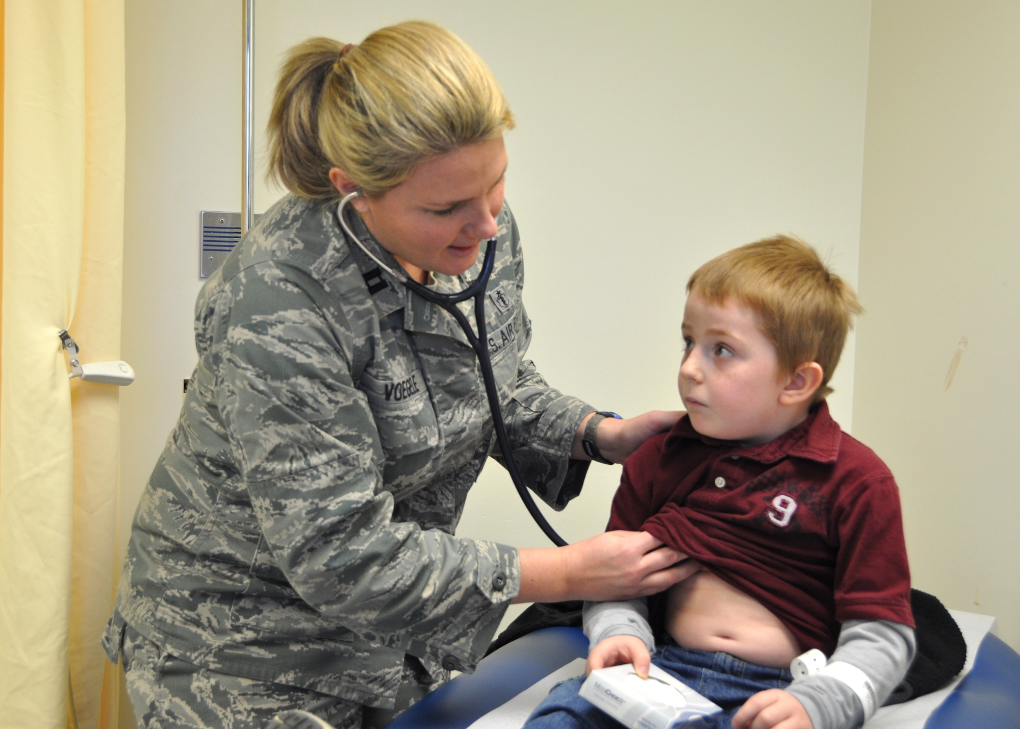 Capt. (Dr.) LauraVoegele, 81st Medical Operations Squadron pediatrician, examines 5-year-old Kevin Evatt Jan. 12 in the pediatric acute care walk-in clinic located within the Keesler emergency department. Kevin’s parents are Staff Sgt. Jeffrey and Mary Evatt, 334th Training Squadron.  (U.S. Air Force photo by Steve Pivnick)