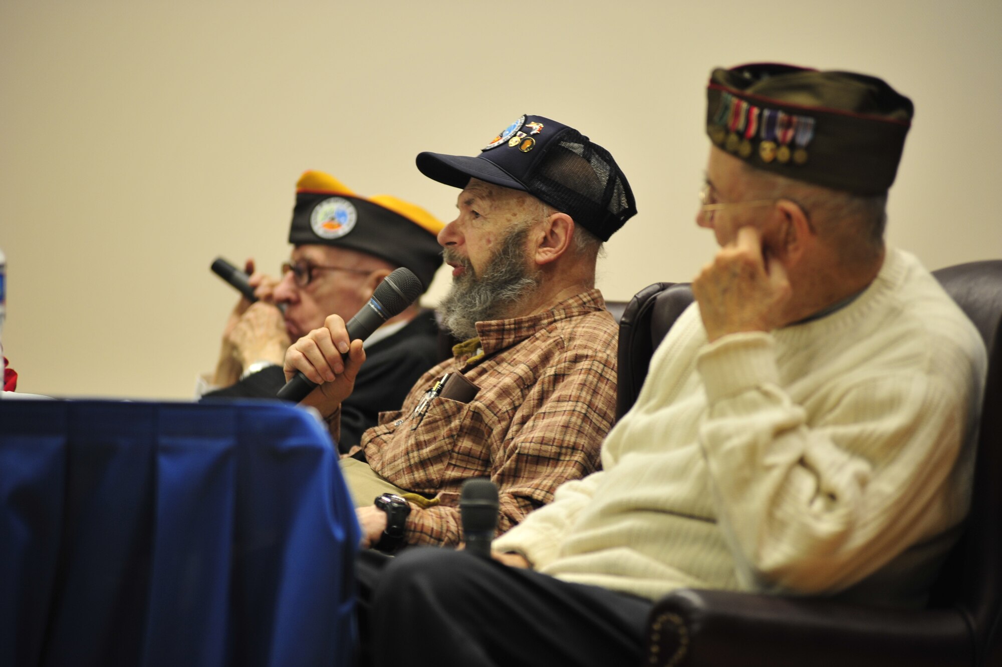 JOINT BASE MCGUIRE-DIX-LAKHURST, N.J. – Left-Right MSG (ret) Lloyd Orth, Arthur Goldschmidt and John Saal, speak with members of the 621st Contingency Operations Support Group during its commanders call here Jan. 14.  The three are members of the Ft Dix/McGuire Chapter of the Veterans of the Battle of the Bulge and came to share their experiences. (U.S. Air Force photo/Tech. Sgt. Parker Gyokeres) (Released)