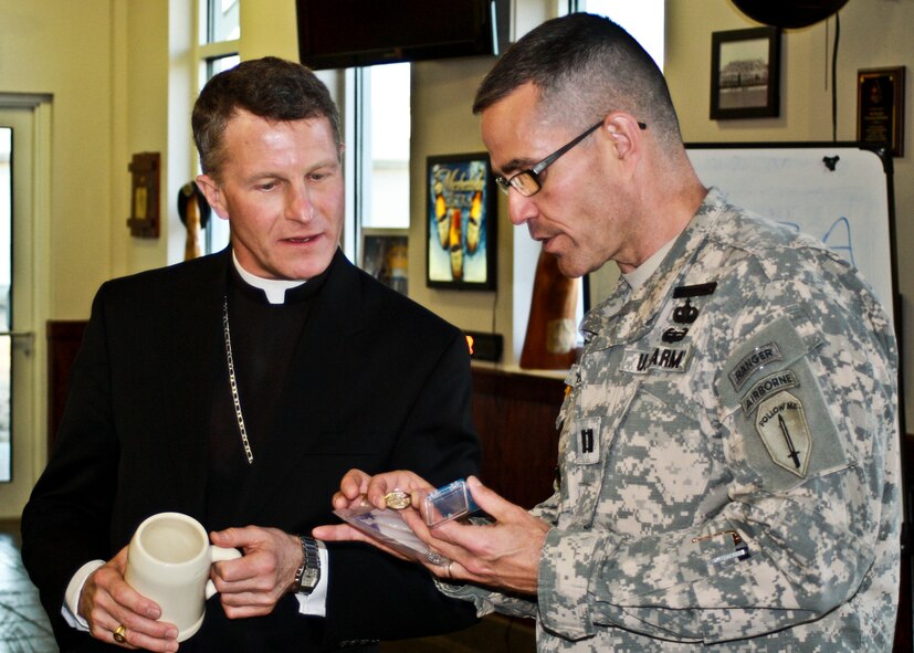 Archbishop Timothy Broglio, who leads the Archdiocese for the Military Services receives an Army Ranger St. Michael medallion from Army Chaplain (Capt.) Charlie Shields presents after touring the 6th Ranger Training Battalion Jan. 17. During his visit to the area to serve Catholic masses at Eglin and Hurlburt Field Jan. 15-18, the archbishop visited with the ministries and people in the military community the base chapel serves.  (Courtesy photo) 