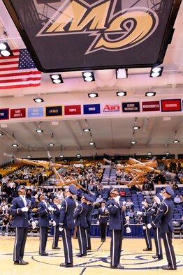 AIR FORCE DISTRICT OF WASHINGTON – Members of the U.S. Air Force Honor Guard Drill Team perform at the George Washington University men’s basketball game Jan. 12 at the Smith Center Washington, D.C. The Military Appreciation Night saluted all those who serve, served, and will serve their country. The colors were presented by the Honor Guard during the national anthem. (U.S. Air Force photo by Senior Airman Steele C. G. Britton)