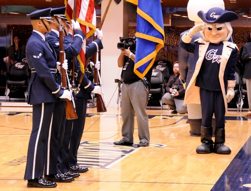 AIR FORCE DISTRICT OF WASHINGTON – Members of The U.S. Air Force Honor Guard Color Team present our nation’s flag to the George Washington University Men’s Basketball team Jan. 12 at the Smith Center Washington, D.C. The audience came together to celebrate service members during Military Appreciation Night at the game. Drill Team members also performed during the half-time show displaying “the best” in military drill. (U.S. Air Force photo by Senior Airman Steele C. G. Britton)
