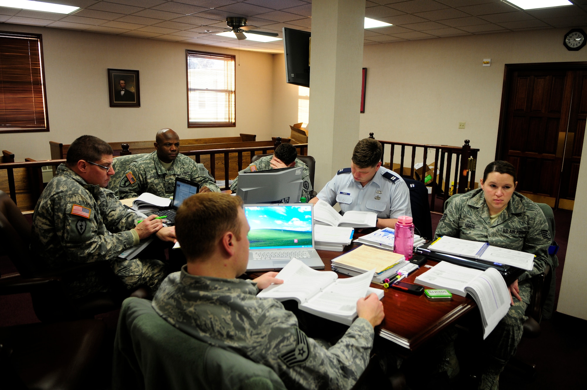 Airmen and Soldiers attend a unit tax advisor course Jan. 10, 2010, Eielson Air Force Base, Alaska. Sixteen volunteers completed 40 hours of instruction covering tax filing regulations in the legal office courtroom.  (U.S. Air Force photo by/Airman 1st Class Yash Rojas)