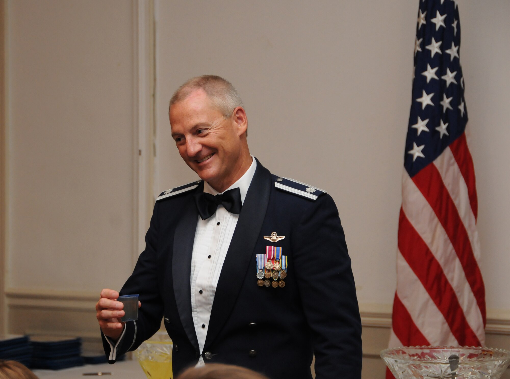 Lt. Col. Brian Davis, deputy operations officer for the 77th Air Refueling Squadron, prepares to toast the mess at a dining out held in July 2010. Lt. Col. Davis was just named to the colonel promotion list. (USAF photo by TSgt. Scotty Sweatt, 916ARW/PA)