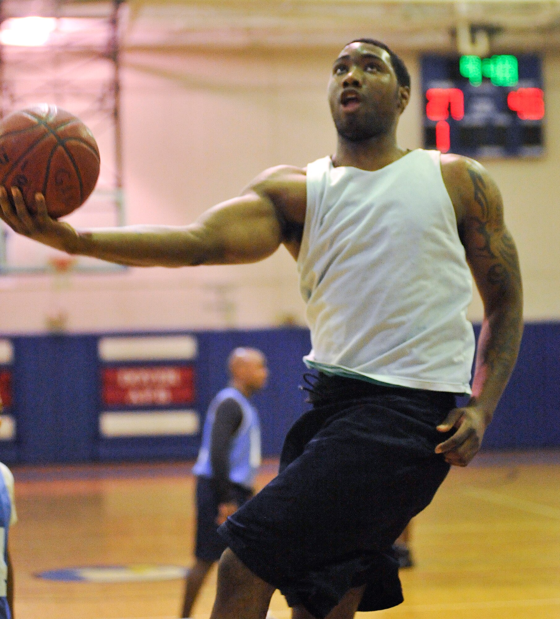 Maurice Neal Jr. goes for a layup during a game between the 436th Aircraft Maintenance Squadron and the 436th Comptroller Squadron Jan. 13 at the Fitness Center. Despite Neal?s performance, AMXS lost to CPTS 56-33. (U.S. Air Force photo/Airman 1st Class Samuel Taylor)