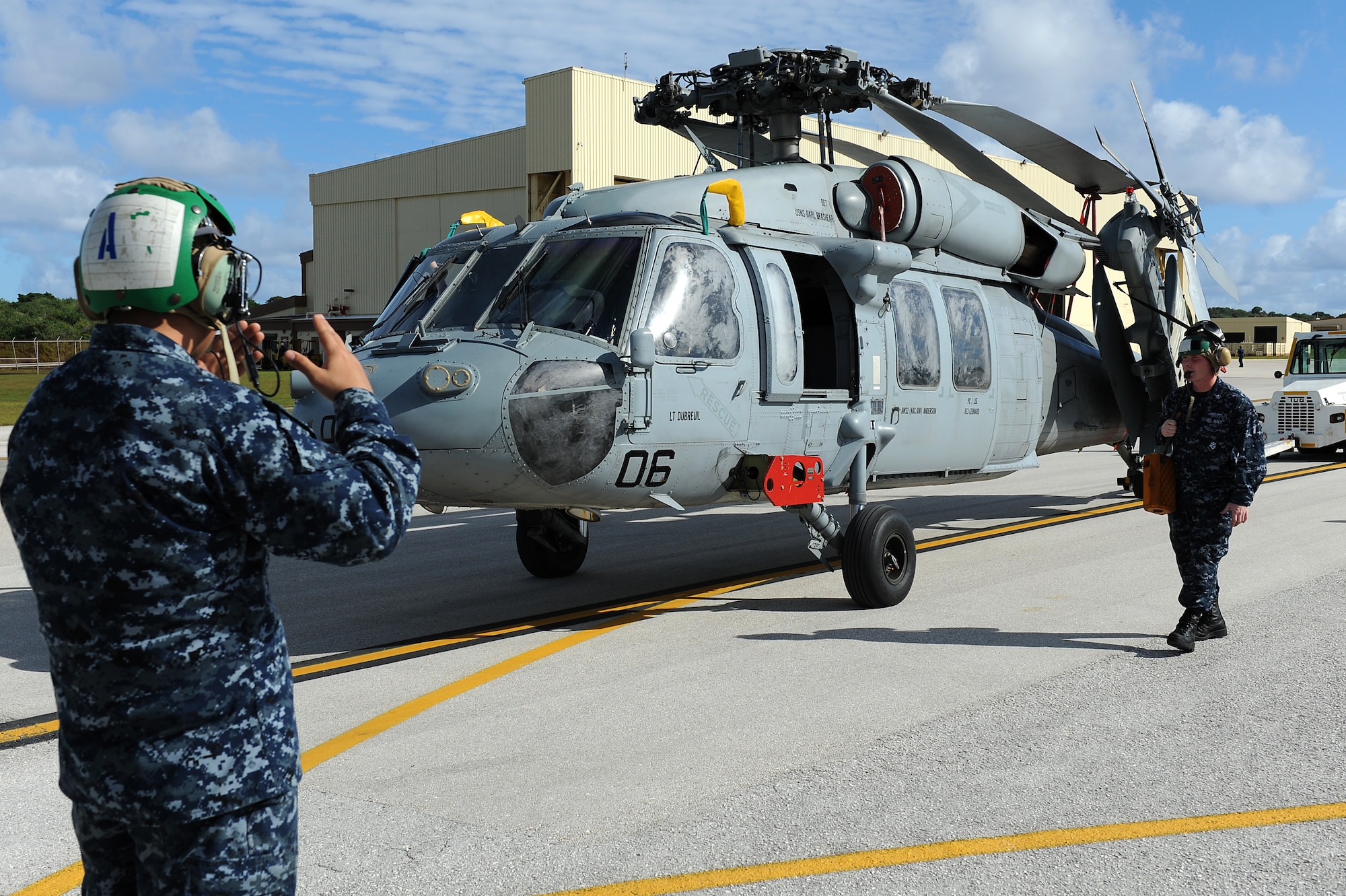 Airmen and Sailors from the 36th Contingency Response Group, Andersen Air Force Base, Guam, practice loading a helicopter onto a C-17 Globemaster III from Joint Base Pearl Harbor-Hickam, Hawaii, Jan. 13. The Aircrew from the 535th Airlift Squadron maximized their airdrop and training opportunities while visiting Guam by dropping airdropping paratroopers, nine training pallets and a boat. (U.S. Air Force photo/Staff Sgt. Mike Meares) 