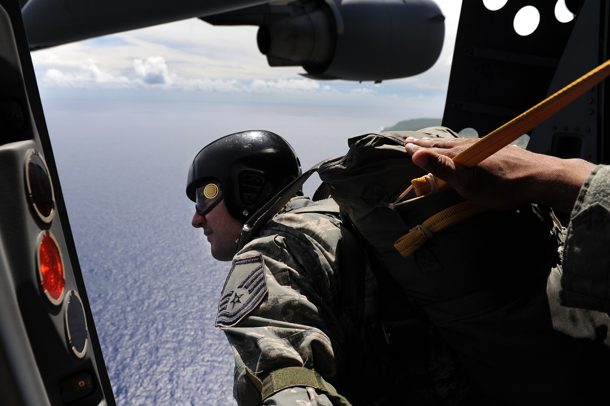 Master Sgt. Justin Papalia, 36th Contingency Response Group jump master, surveys the drop zone during proficiency training Jan. 13.  Hickam aircrew from the 535th Airlift Squadron provided four static line jumps for the 36th CRG?s proficiency training over two separate days. (U.S. Air Force photo/Staff Sgt. Mike Meares)