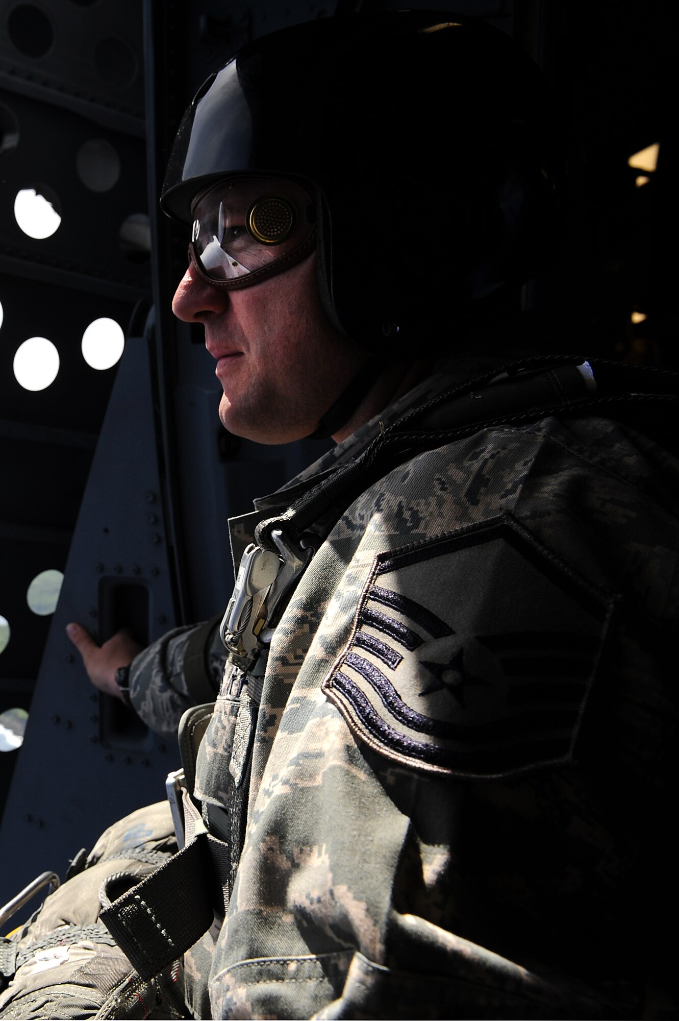 Master Sgt. Justin Papalia, 36th Contingency Response Group jump master, surveys the drop zone during proficiency training Jan. 13.  Hickam aircrew from the 535th Airlift Squadron provided four static line jumps for the 36th CRG?s proficiency training over two separate days. (U.S. Air Force photo/Staff Sgt. Mike Meares)