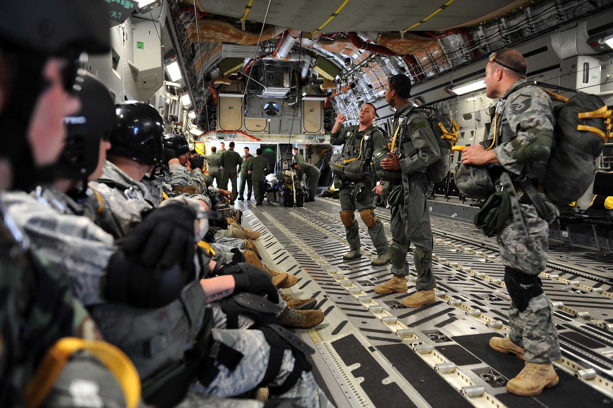 The 36th Contingency Response Group jumpmasters go over the details of the afternoon static line jumps during proficiency training Jan. 13.  Hickam aircrew from the 535th Airlift Squadron provided four static line jumps for the 36th CRG?s proficiency training over two separate days. (U.S. Air Force photo/Staff Sgt. Mike Meares)