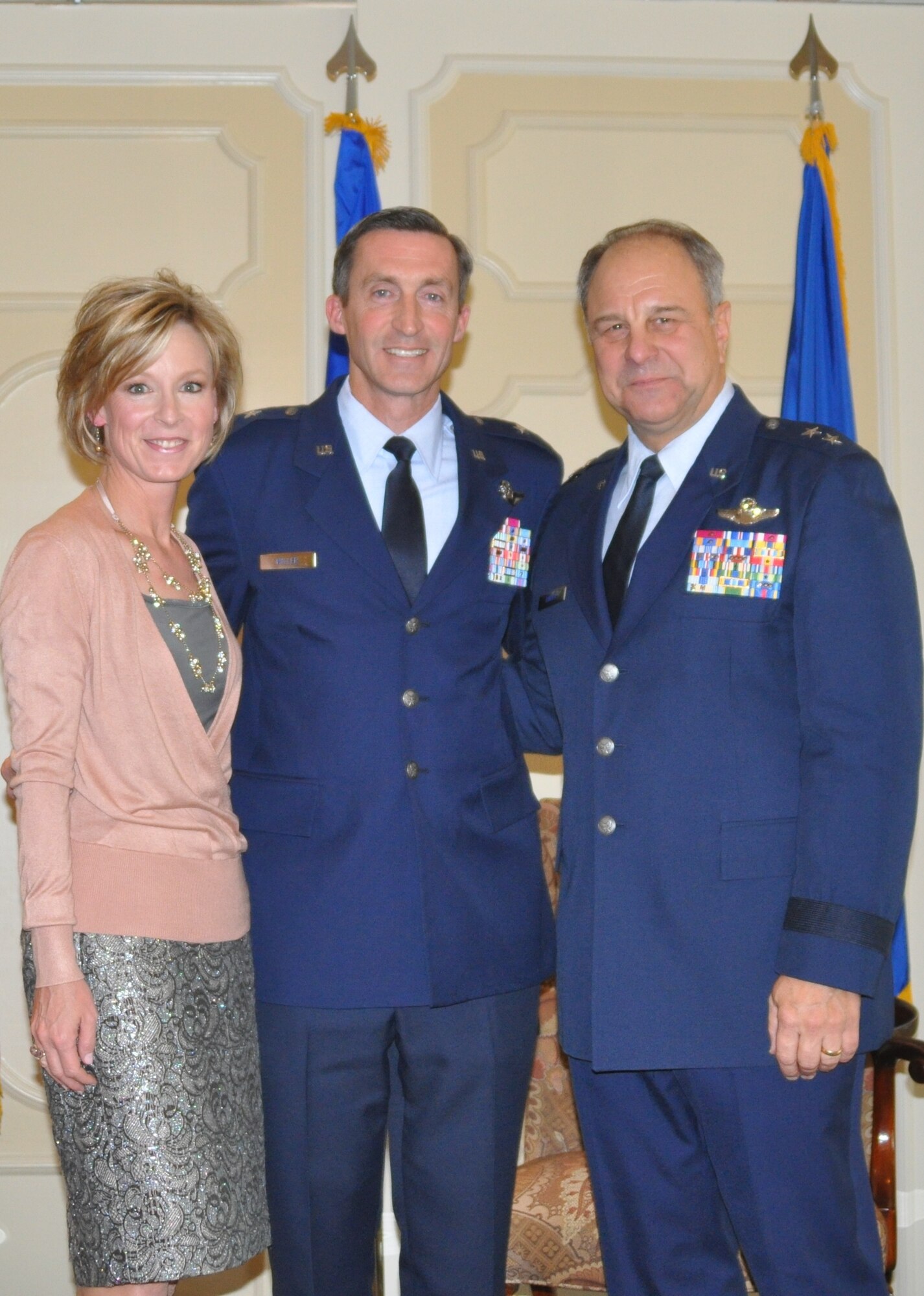 Mrs. Dori Miller (left), wife of Brig. Gen. Ronald B. Miller (center), 301st Fighter Wing commander, and Maj. Gen. Roger Binder, assistant to the commander Air Combat Command, celebrate the accomplishments of the 301st Fighter Wing commander at his promotion ceremony Jan. 15, 2011. General Miller took command of the wing Oct. 3, 2010. (U.S. Air Force photo/SrA Melissa Harvey)
