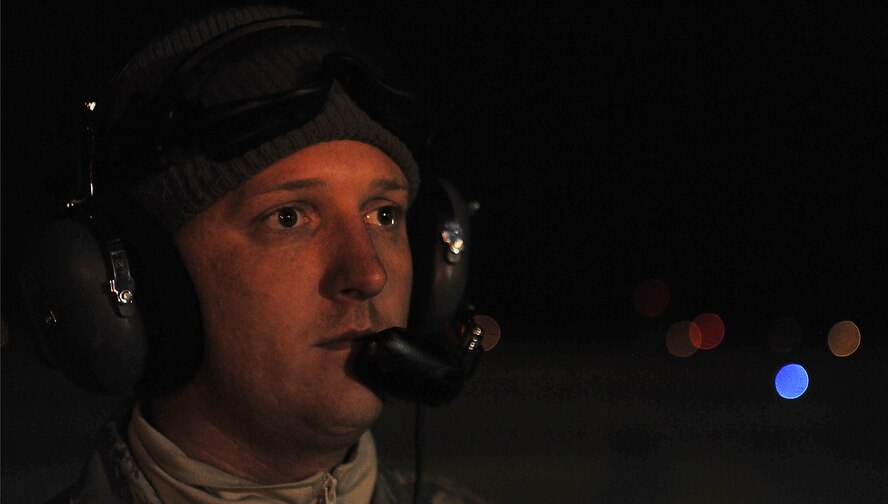 MOODY AIR FORCE BASE, Ga.-- Senior Airman Justin Smock, 41st Aircraft Maintenance Unit crew chief, stands in front of a HH-60G Pavehawk
before take-off Jan. 15. Members from the 41st and 38th Rescue Squadrons 
provided support to local authorities to help search for a missing teenager.
(U.S. Air Force photo/Airman 1st Class Joshua Green)(RELEASED)
