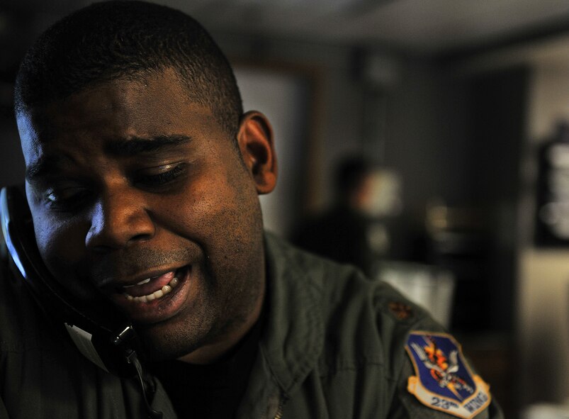 MOODY AIR FORCE BASE, Ga.-- Maj. Ronald Henderson, 41st Rescue Squadron
assistant director of operations, takes a call to provide aid to local authorities 
for a missing teenager Jan. 15. Members from the 38th Rescue
Squadron also provided their support in the search. (U.S. Air Force photo/Airman 1st Class Joshua Green)(RELEASED)
