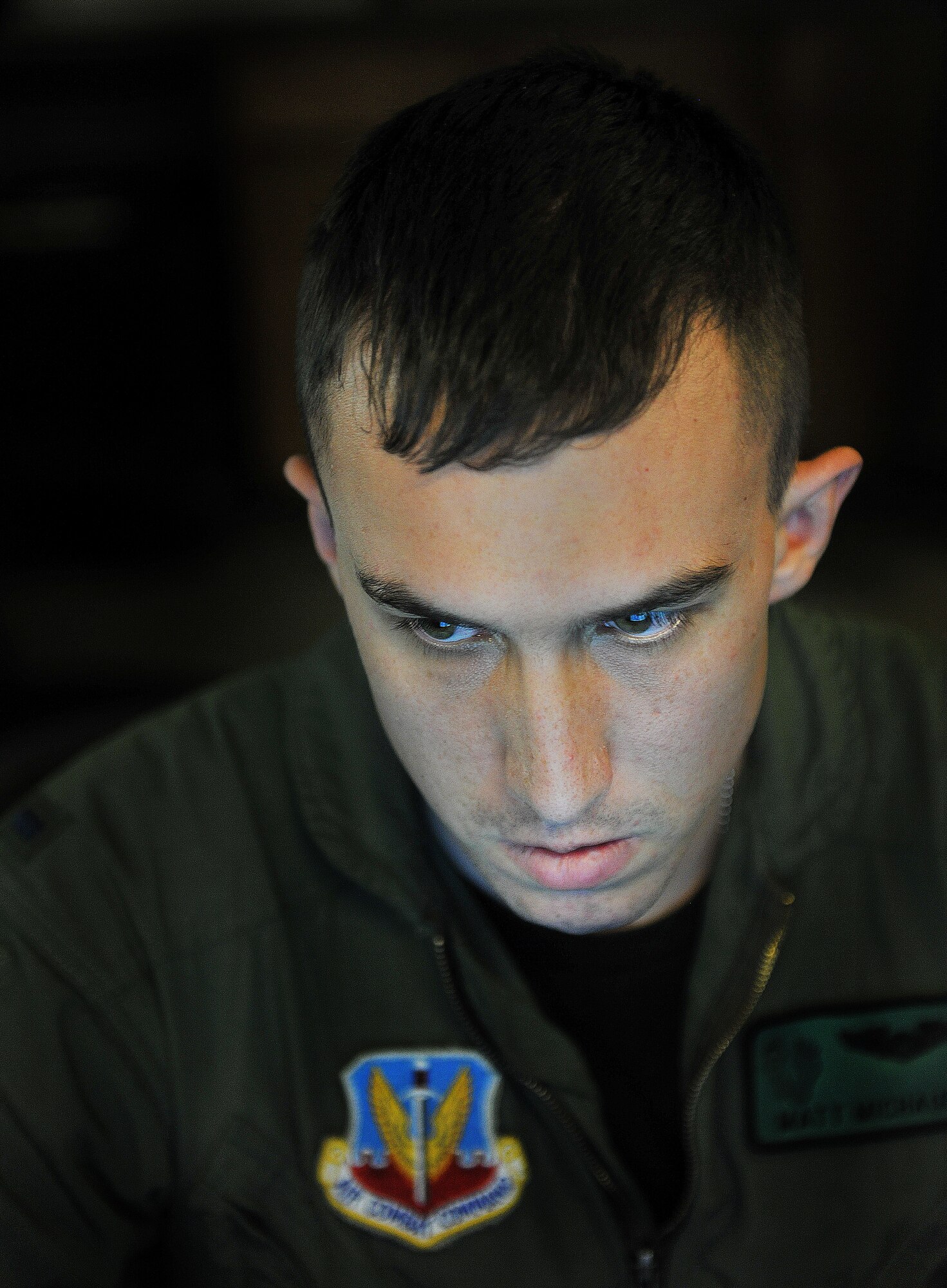MOODY AIR FORCE BASE, Ga.-- 1st Lt. Matthew Michaud, 41st Rescue Squadron
co-pilot, uses a computer to search for location information during a rescue
mission Jan. 15. Members from the 41st and 38th RQS provided support to
local authorities to help search for a missing teenager. (U.S. Air Force
photo/Airman 1st Class Joshua Green)(RELEASED)
