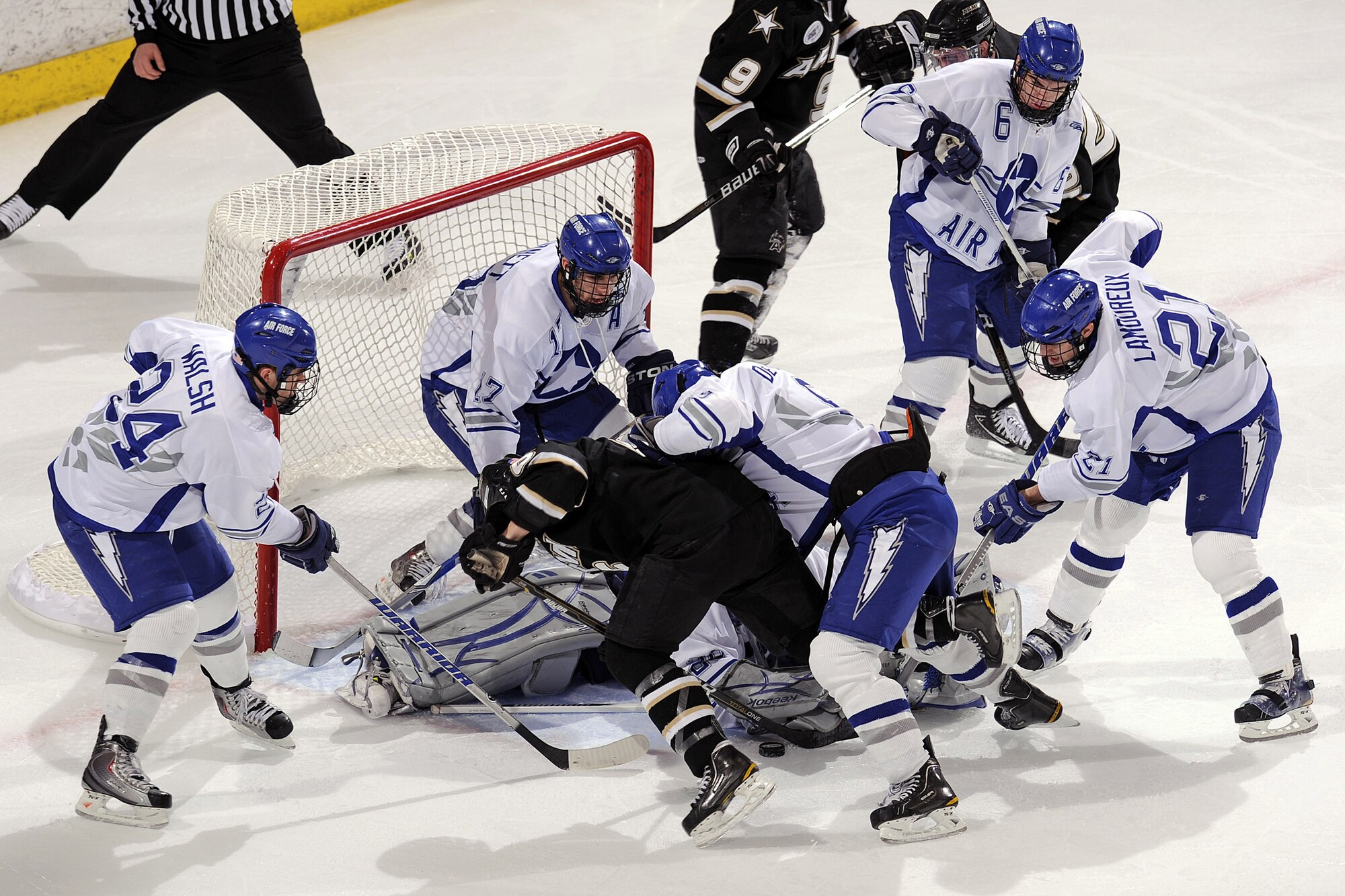 Falcons goalie Jason Torf successfully defends the goal during a flurry against the Army Black Knights Jan 15, 2011, at the Cadet Ice Arena in Colorado Springs, Colo. Army went on to defeat the Falcons 5-4. (U.S. Air Force photo/Mike Kaplan) 