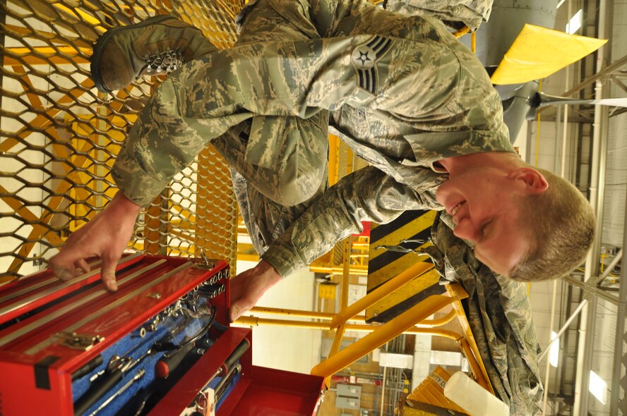 Senior Airman Eric Holtz  934th Maintenance Squadron engine specialist, grabs his tools as he prepares for work at the Minneapolis-St. Paul IAP ARS, Minn (Air Force Photo/Tech. Sgt. Bob Sommer)