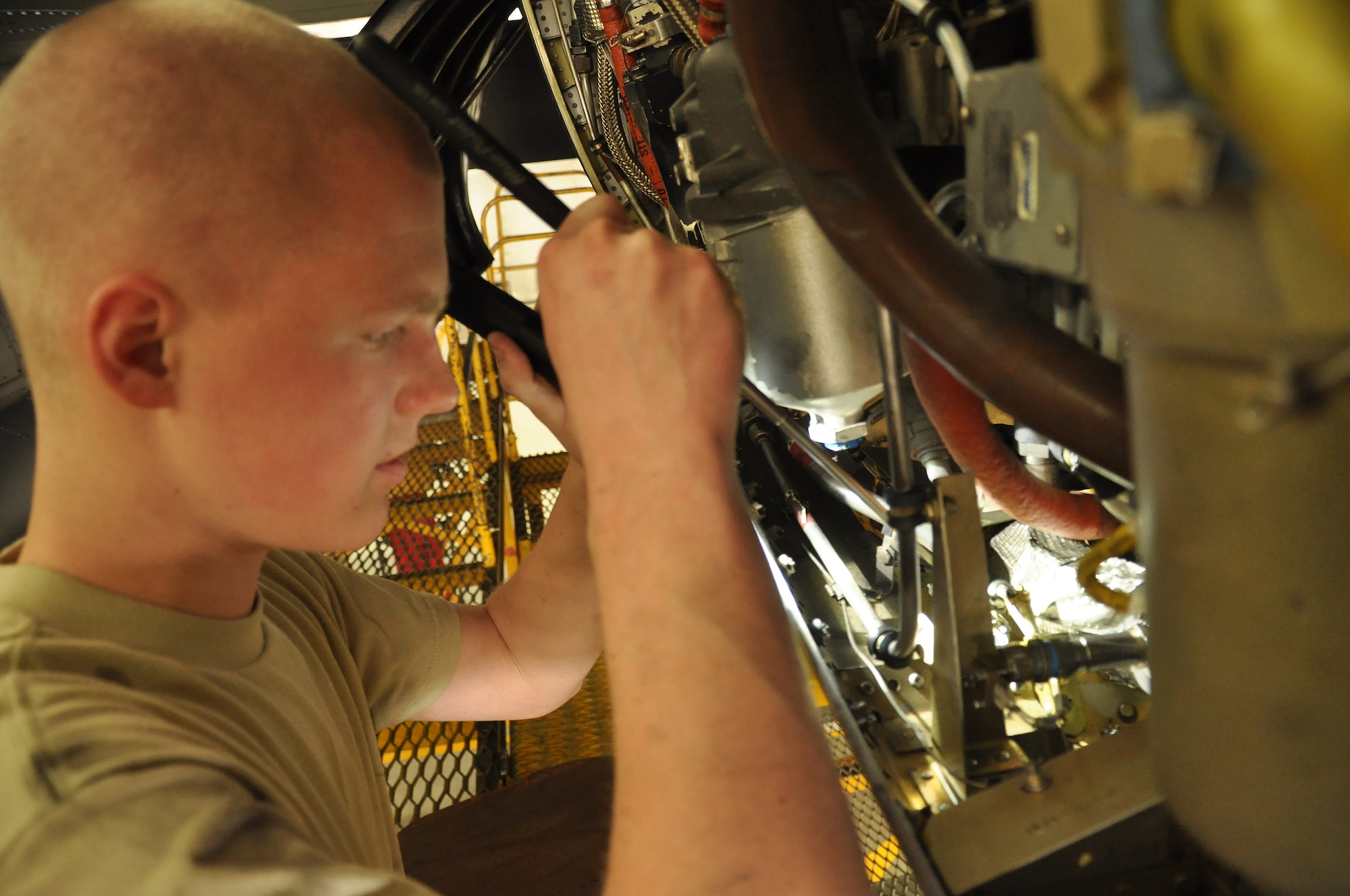 Airman,Christopher Becker, 934th Maintenance Squadron engine specialist, inspects the engine of a C-130 Hercules at the Minneapolis-St. Paul IAP ARS, Minn (Air Force Photo/Tech. Sgt. Bob Sommer)