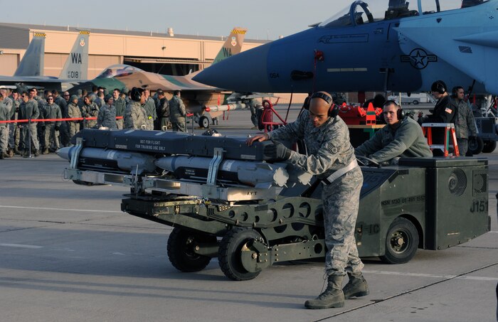 NELLIS AIR FORCE BASE, Nev. --  Staff Sgt. Avery Kirkwood, 57th Aircraft Maintenance Squadron aircraft armament systems journeyman, checks a GBU-39 Small Diameter Bomb during a weapons load competition on the Nellis flightline Jan. 14. Weapons load competitions are conducted quarterly to keep Airmen sharp and recognize superior performers. Weapons load teams are evaluated for use of the checklist, safety, and overall speed. (U.S. Air Force photo by Airman 1st Class George Goslin)