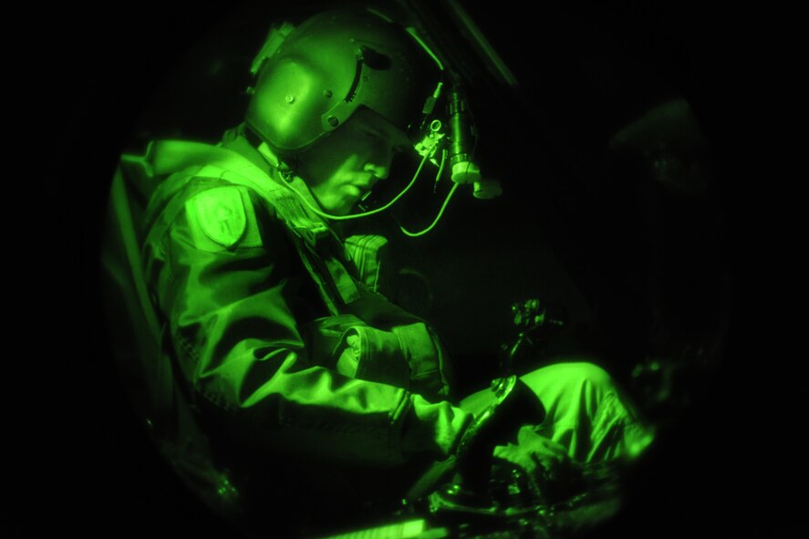 MOODY AIR FORCE BASE, Ga.-- Maj.  Russ Cook, 41st Rescue Squadron HH-60G Pavehawk helicopter instructor pilot, finishes his preflight check before take-off Jan. 15.  The 41st and 38th RQS worked with local authorities to conduct a search and rescue mission for a missing local teenager. (U.S. Air Force photo/Airman 1st Class Benjamin Wiseman)(RELEASED)