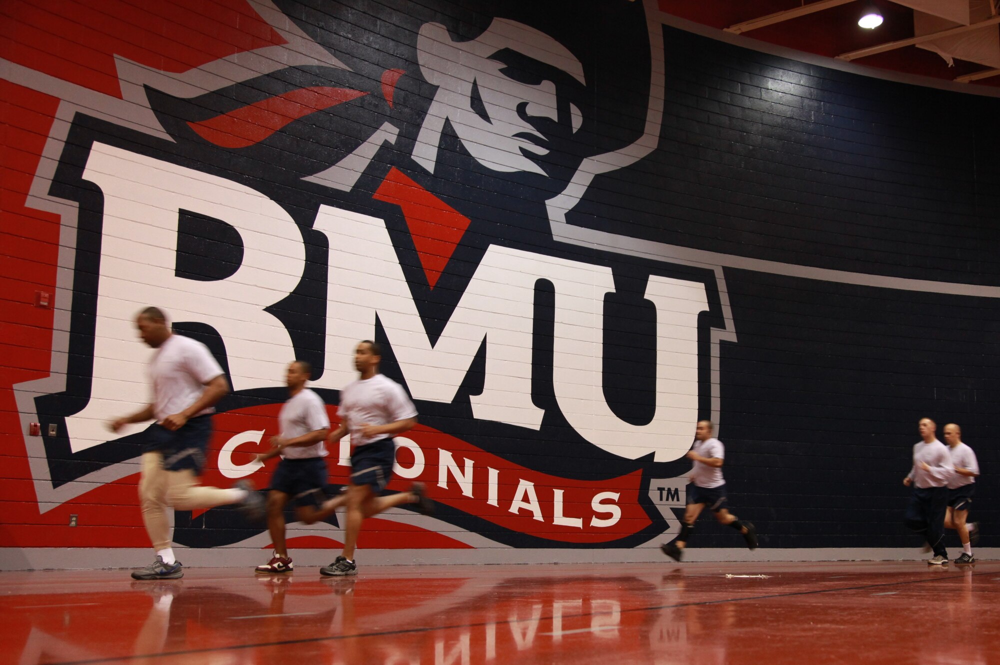 Airmen finish the final laps in their biannual Air Force Fitness Test at Robert Morris University’s indoor track. This running facility provides shelter during these cold winter months, and enables Airmen to test while temperatures are below 20 degrees Fahrenheit.(Photo by Tech Sgt. Ralph Van Houtem/U.S. Air Force photo)
