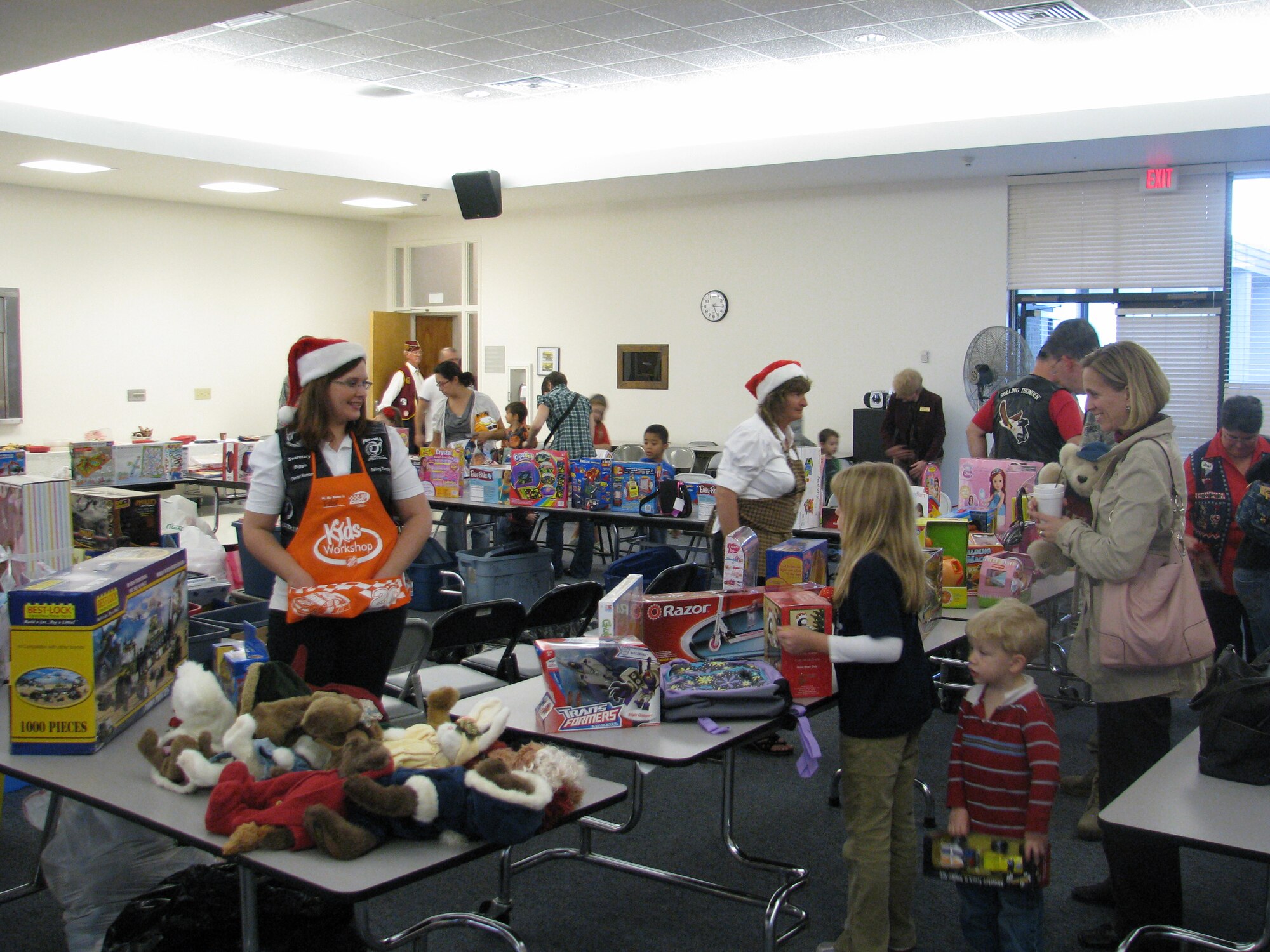 Families at MacDill receive gifts as a result of the commitment and generosity of “Elves” working in honor of the American Ex PoWs. The Florida Chapter eleven of the Rolling Thunder continued a 17-year tradition of hosting a Children’s Christmas party at MacDill Air Force Base on behalf of the American Ex PoWs. (Courtesy photo) 