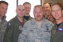 916th Air Refueling Wing Safety officers and NCOs past and present, along with Col. Randy Ogden, wing commander, cut the ribbon unveiling the remodeled safety office on Friday, Jan. 14. (USAF photo by Maj. Shannon Mann, 916ARW/PA)