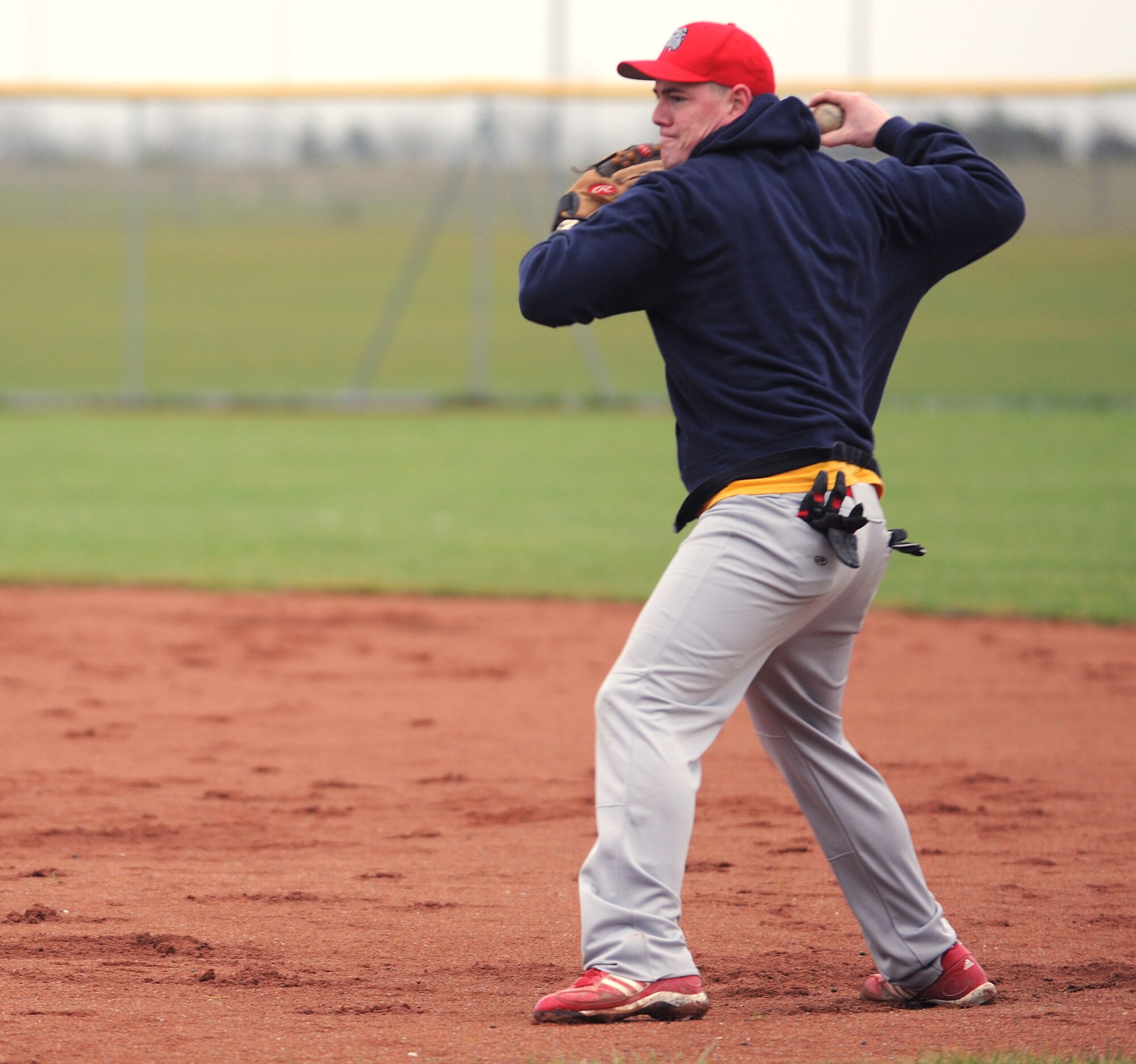RAF MILDENHALL, England -- Steve Richardson, 100th Maintenance Squadron structural maintenance craftsman throws a ball to home plate during baseball tryouts Jan. 15, 2011, at the RAF Feltwell baseball fields.  Members from RAFs Mildenhall, Lakenheath and Feltwell tried out for the Mildenhall Bulldogs. (U.S. Air Force photo/Senior Airman Tabitha M. Lee)