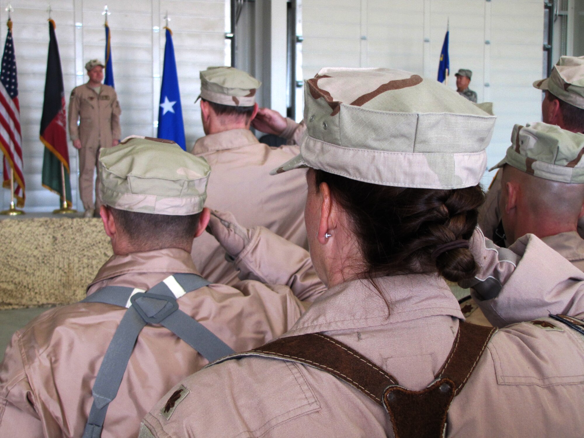 U.S. Air Force Col. Michael Outlaw receives his first salute as commander of the 738th Air Expeditionary Advisory Group during a change of command ceremony at the Kandahar Air Wing Jan. 15. Outlaw relieves Col. Bernard Mater as commander, with Mater moving on to become the vice commander of the 438th Air Expeditionary Wing in Kabul. (U.S. Navy photo by Mass Communications Specialist 2nd Class Vladimir Potapenko/RELEASED)