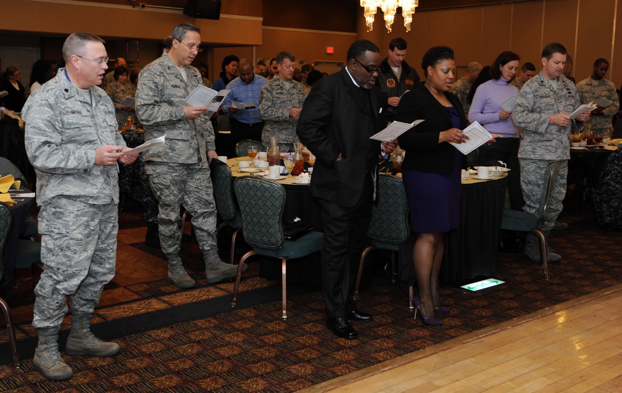 Members of the Misawa community sing ?Lift every voice and sing? during Martin Luther King, Jr. luncheon at Misawa Air Base, Japan, Jan. 13, 2011. The event was part of the 25th Anniversary of Martin Luther King Jr. national holiday. (U.S. Air Force photo by Tech. Sgt. Russell McBride/Released)