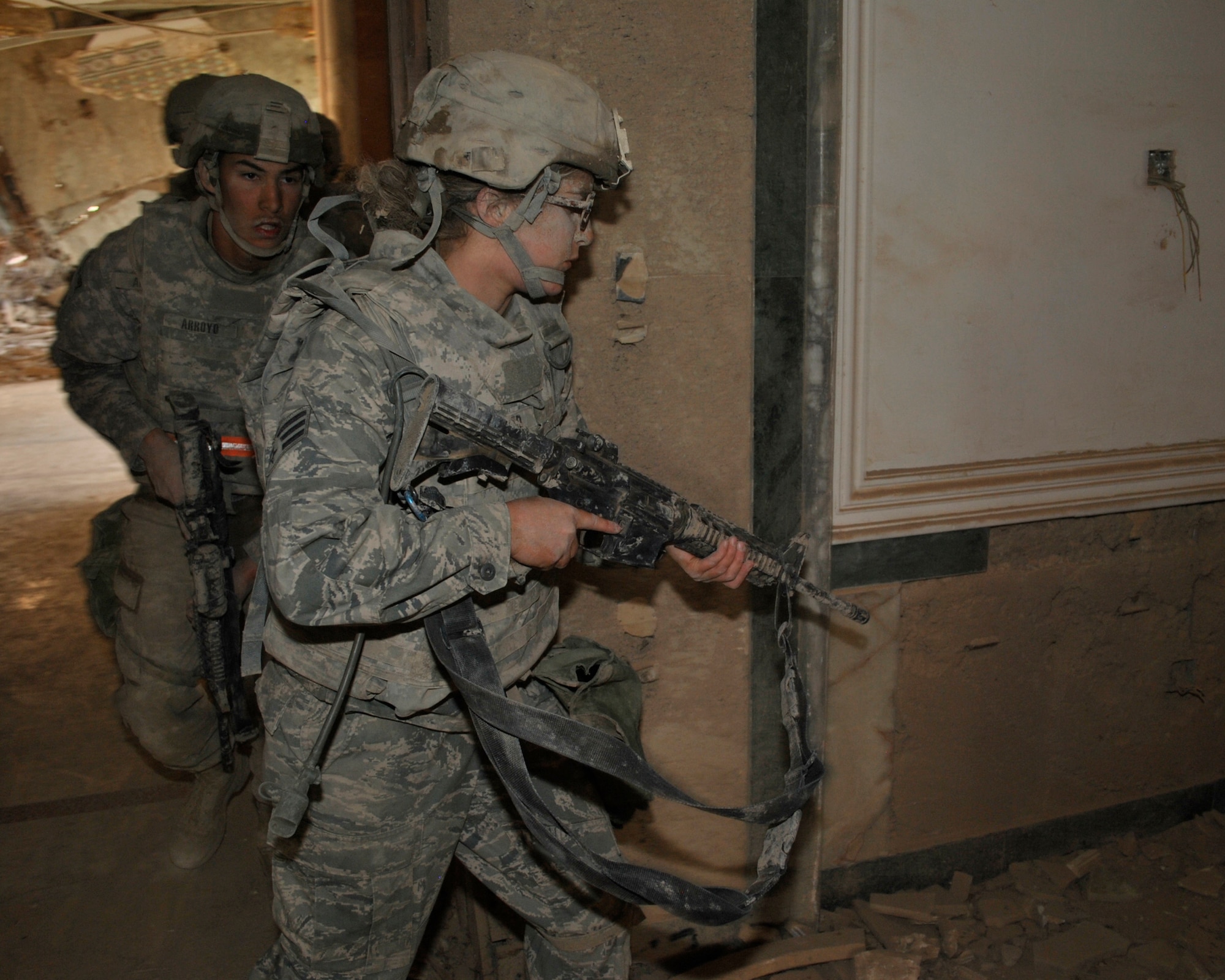 Senior Airman Courtney Beard, 467th Expeditionary Intelligence Squadron intelligence analyst, leads a team through an abandoned palace Nov. 21 on Victory Base Complex, Iraq. The Brooklyn, N.Y., native was the first female Airman to complete the 18-hour Spur Ride, a series of mental and physical tests, held by the III Corps, Task Force Phantom. (U.S. Army photo by Sgt. Kelly K. Morehouse)
