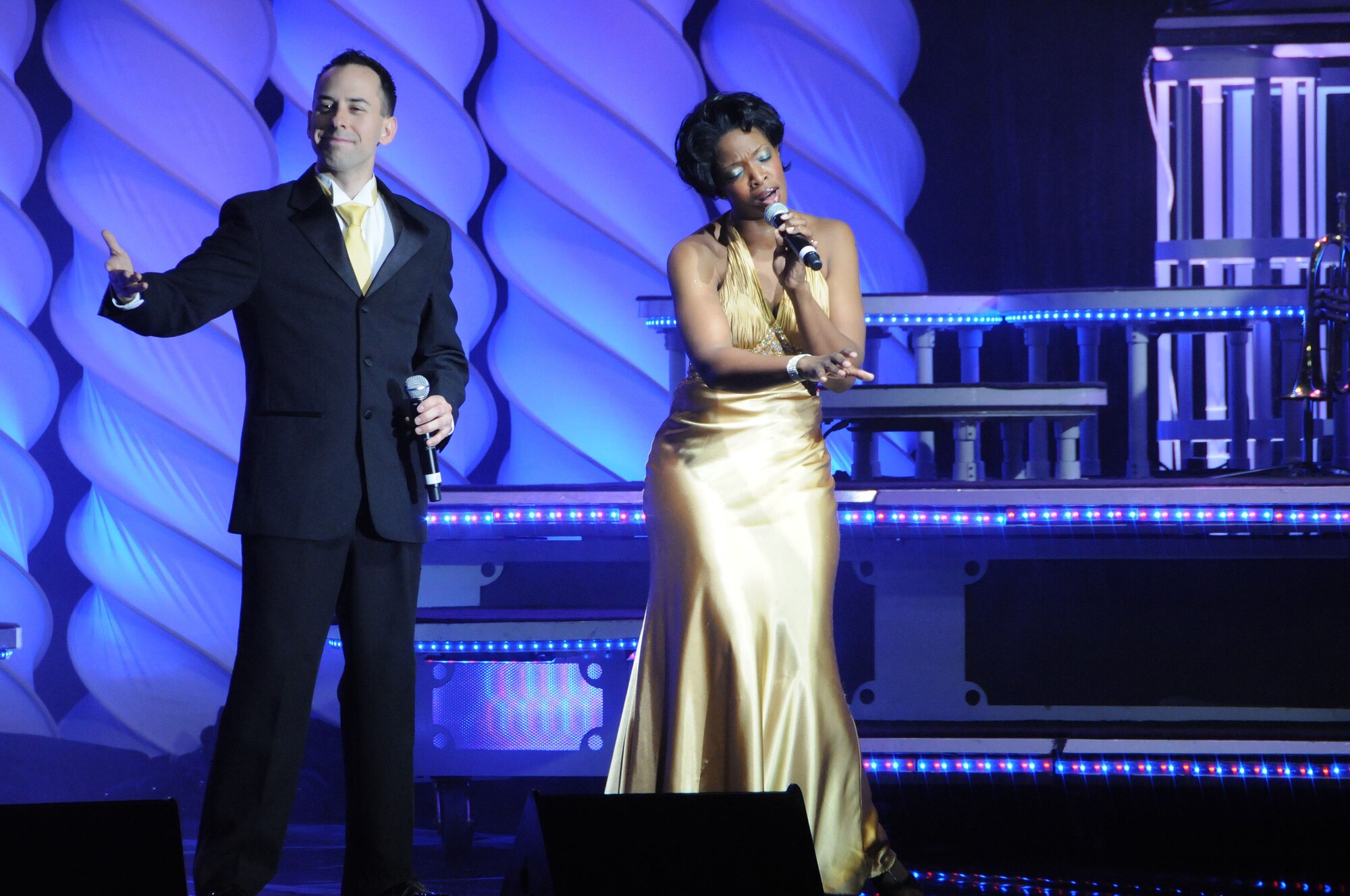 Senior Airman Devin Martin and Airman 1st Class Megan Harvey perform "Bridge Over Troubled Water" for the members of the 18th Wing during their visit to Kadena Jan. 15. Tops in Blue, the Air Force's premier entertainment showcase, performed a variety of songs for service members and their families during their three-day tour to the island. (U.S. Air Force photo/Staff Sgt. Darnell T. Cannady)
