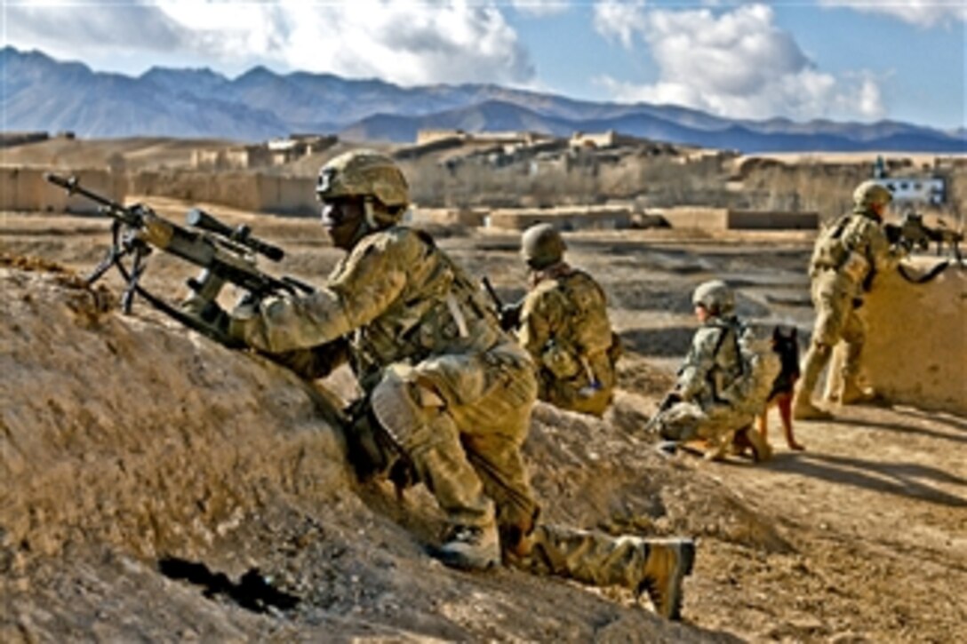 U.S. Army Pfc. Ryan B. Stuart provides security for Afghan forces in the Kharwar district in Afghanistan's Logar province on Jan. 11, 2011.  Stuart is assigned to the 10th Mountain Division's Company D, 2nd Battalion, 30th Infantry Regiment, 4th Brigade Combat Team, Task Force.  U.S. and Afghan forces recovered two weapons caches and detained four people during the two-day operation.  